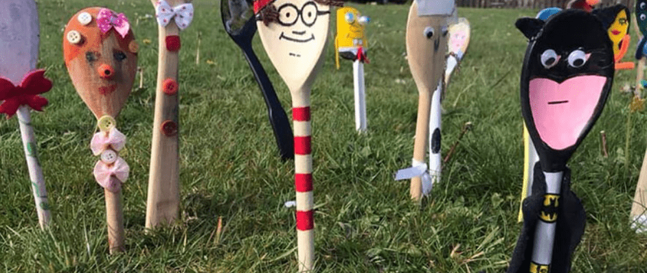 Spoons dressed as characters in a garden
